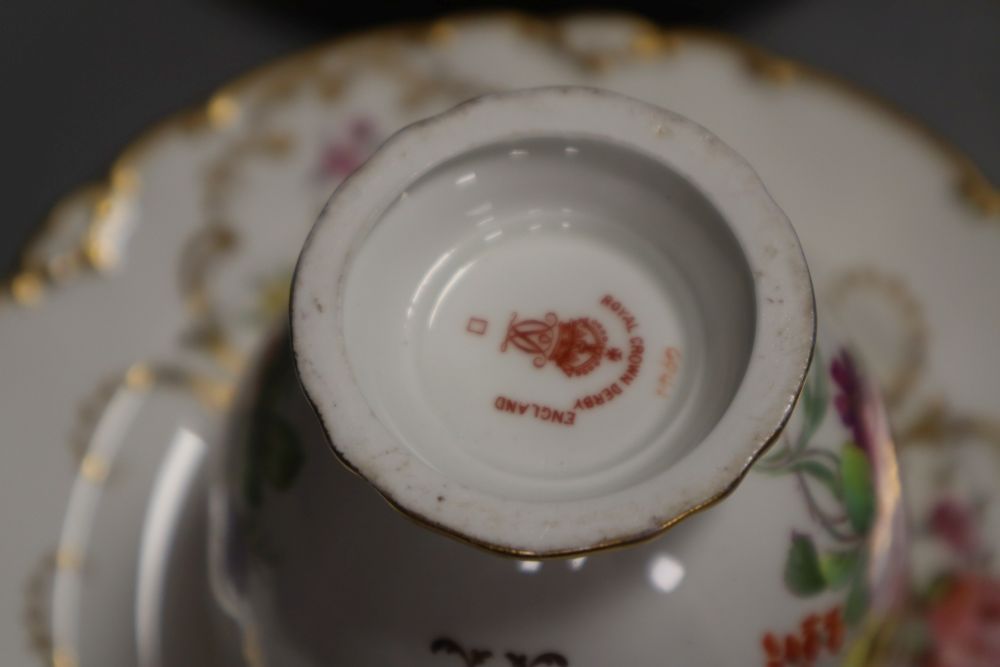 A Royal Crown Derby teacup, a saucer and a tea plate,